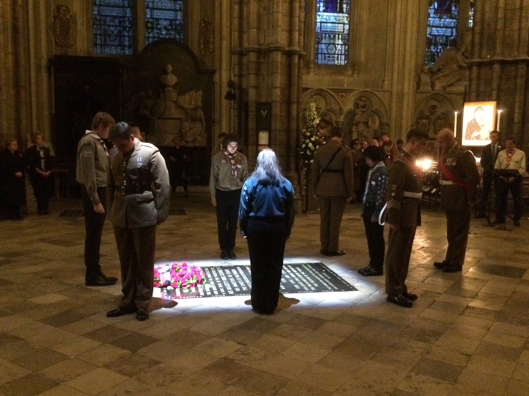 Image shows Scouts holding a vigil at the memorial stone to Philipps in Westminster Abbey
