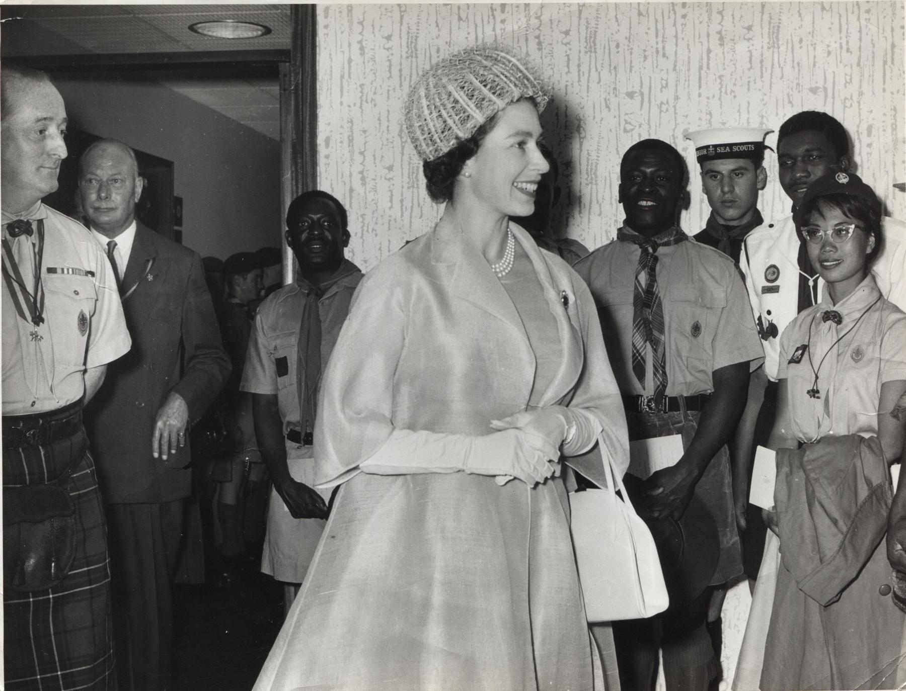 Black and white photo of the Queen with Scouts