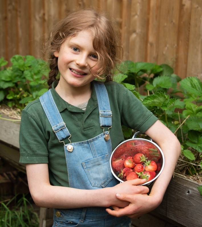 Thomas, a Cub Scout farming organic food at home