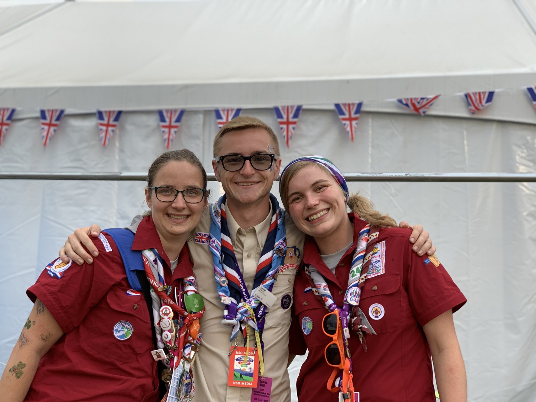 Two female volunteers and one male volunteer celebrating at a Jamboree party