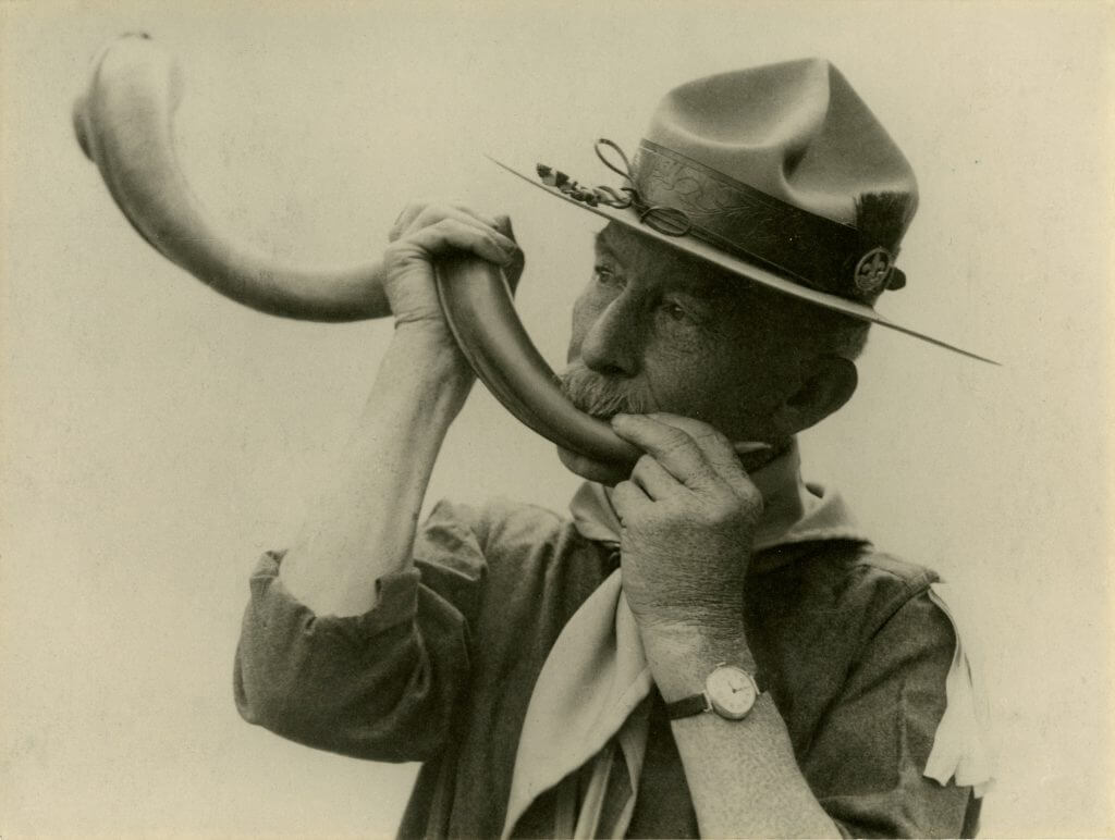 Robert Baden-Powell holding the Kudu horn at the Brownsea Island pilot camp