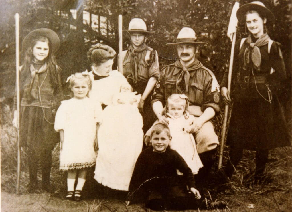 An early Scouting family showing the father as a Scoutmaster, the son a Boy Scout and the daughters as Girl Scouts. c1909
