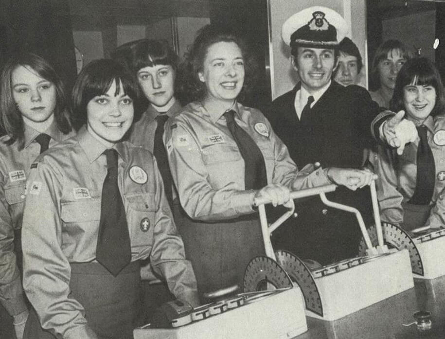 Female Venture Scouts in uniform and smiling in 1977