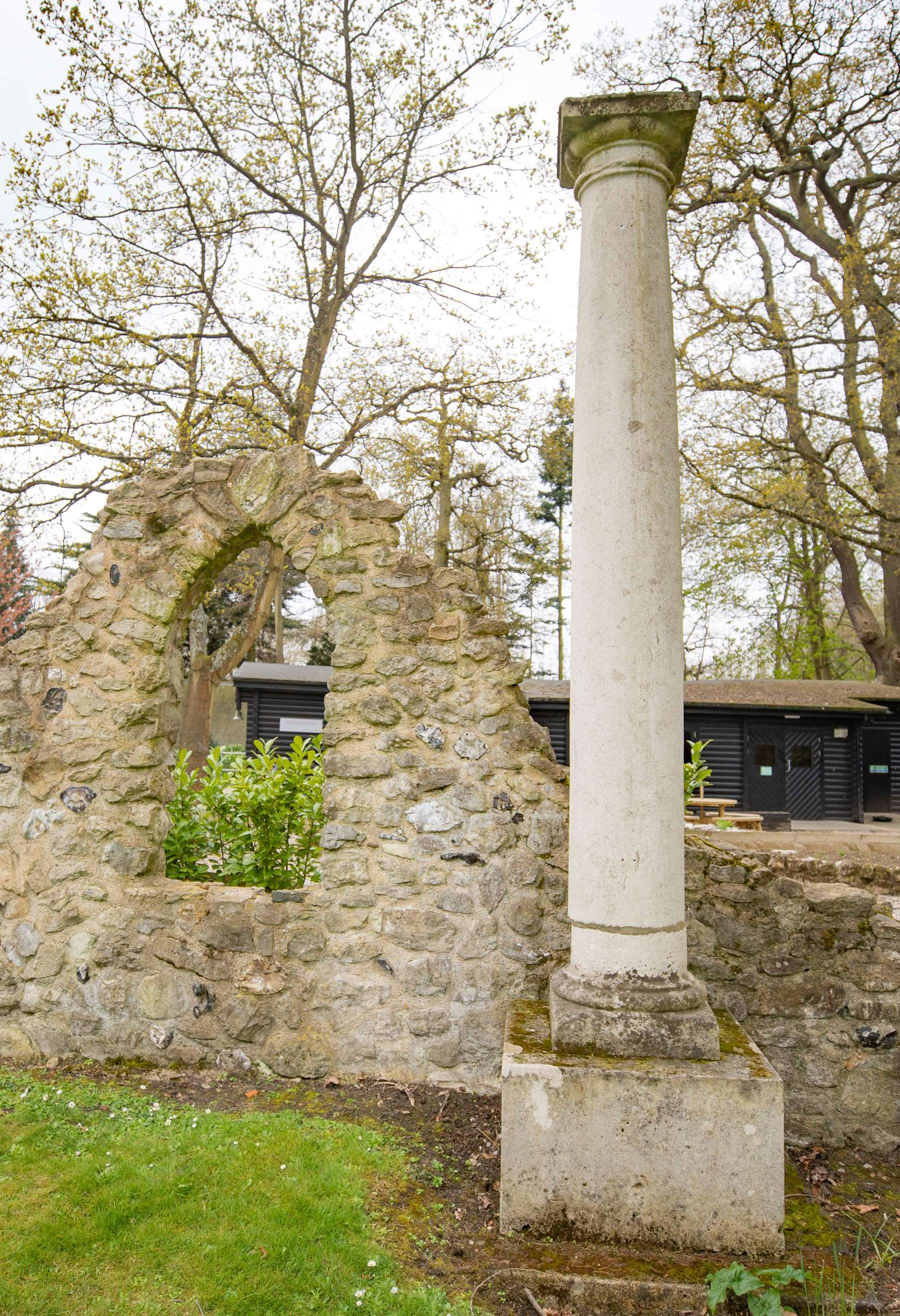 Image shows a single stone column in the grounds of Gilwell Park