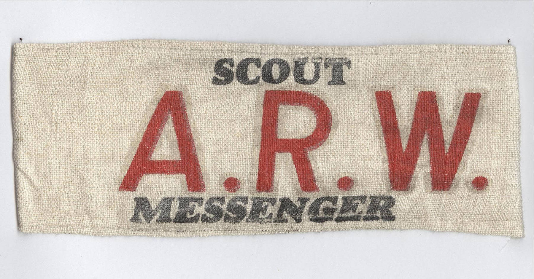 Cream armband with the words 'Scout A.R.W. Messenger'