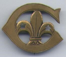 Image shows the Cornwall Badge, which is a bronze C encapsulating a fleur-de-lis