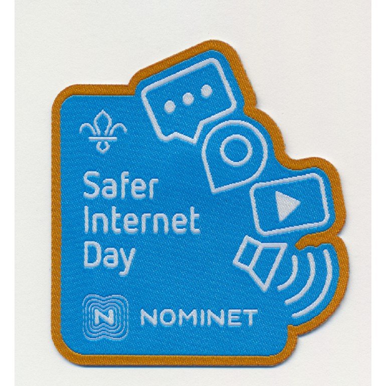Safer Internet Day Badge, light blue with Scouts fleur-de-lis logo and partner Nominet logo, with 2D images of digital symbols around such as location pin, play button, speak bubble, all of these are in white