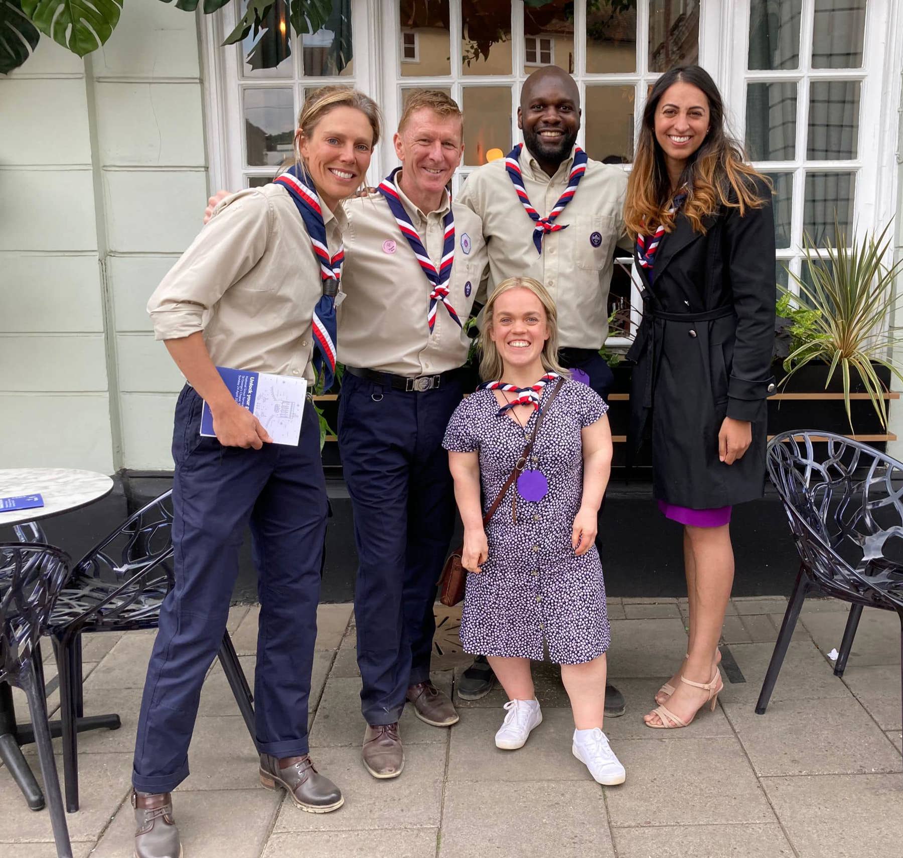Megan Hine, Tim Peake, Dwayne Fields, Ellie Simmonds, Preet Chandi standing smiling at the camera, all with Scouts uniform or necker