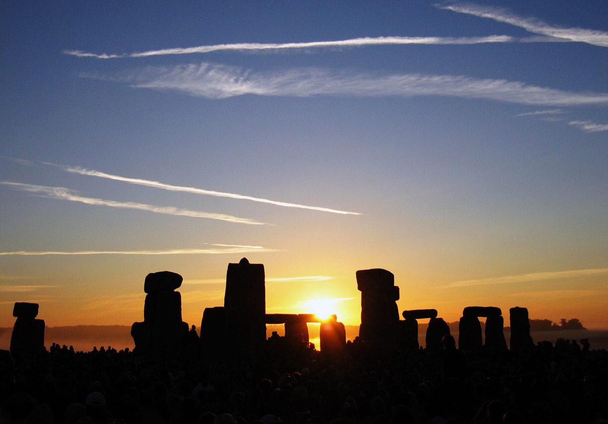 The sun rising in the morning over Stonehenge on Summer Solstice