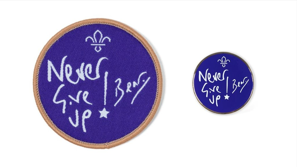 The Never Give Up cloth badge and pin