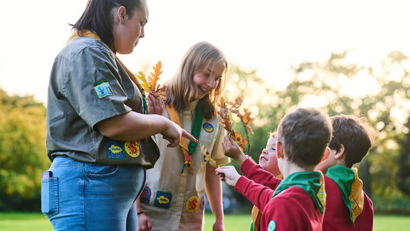 Scout volunteers helping young people