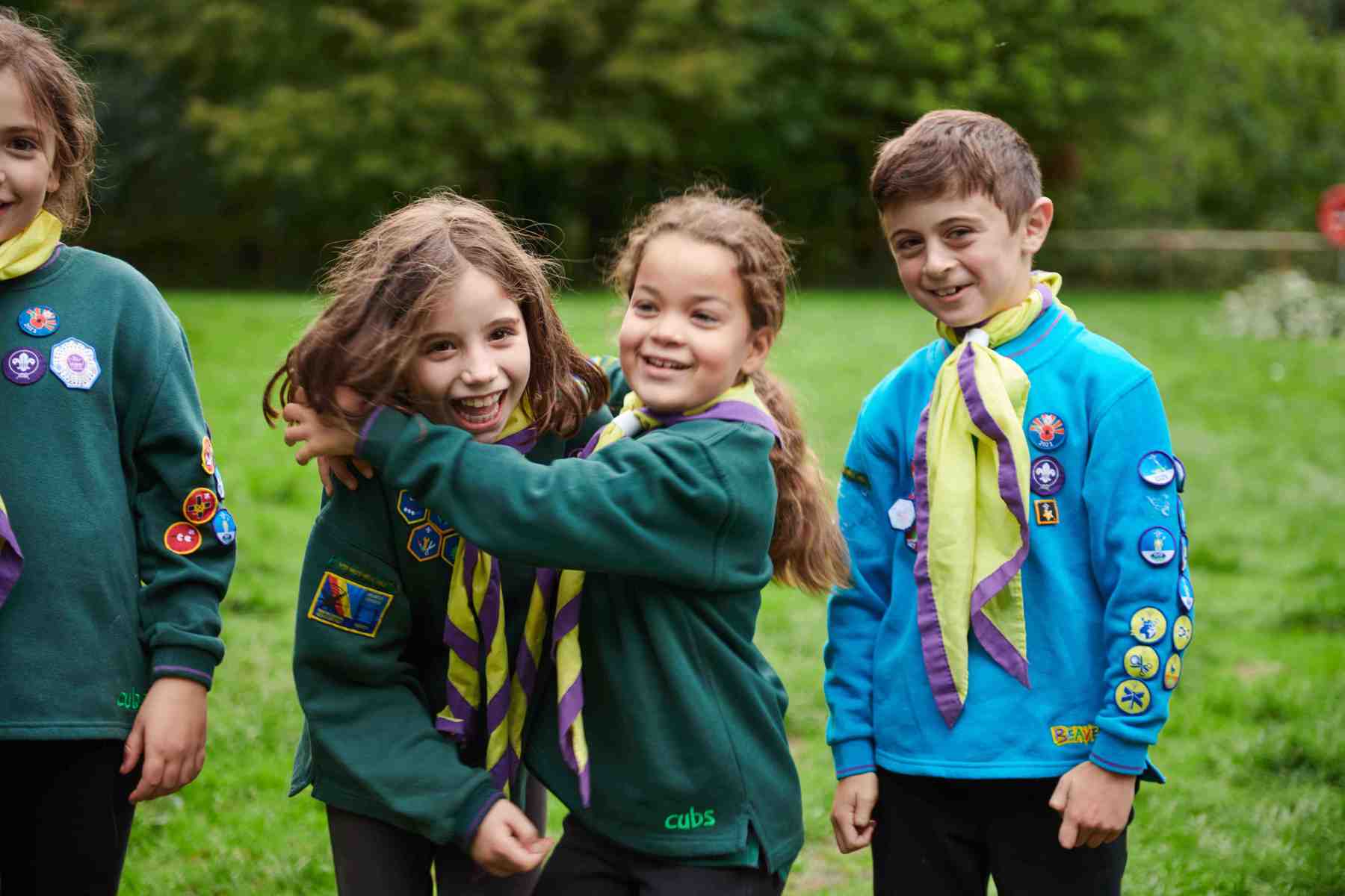 Two Cub Scouts hugging