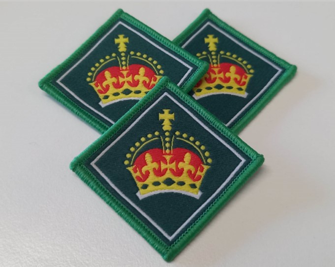 Three King's Scout Award badges