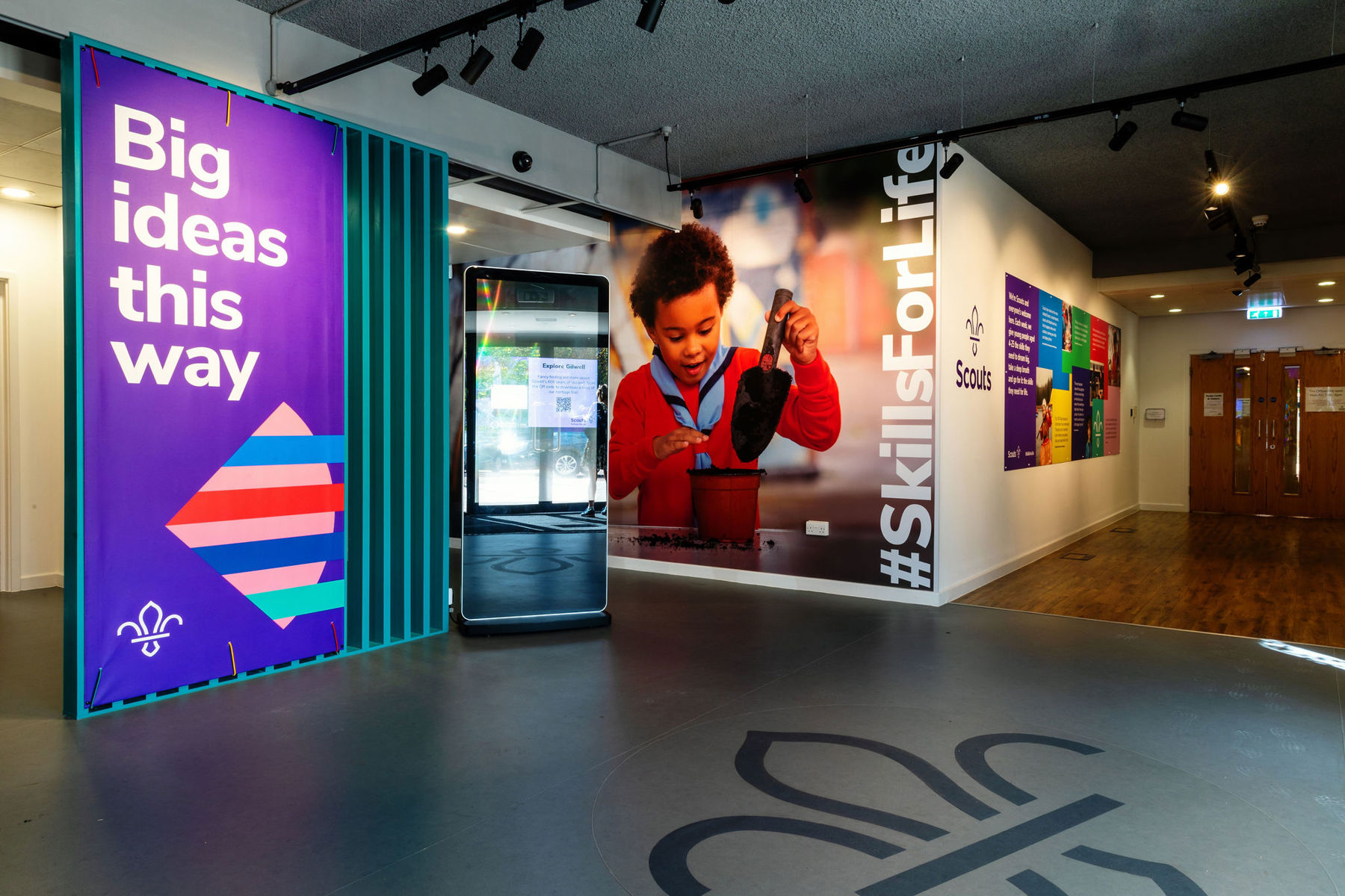 Big ideas this way, #SkillsForLife and an image of a Squirrel Scout in the colourful Gilwell space