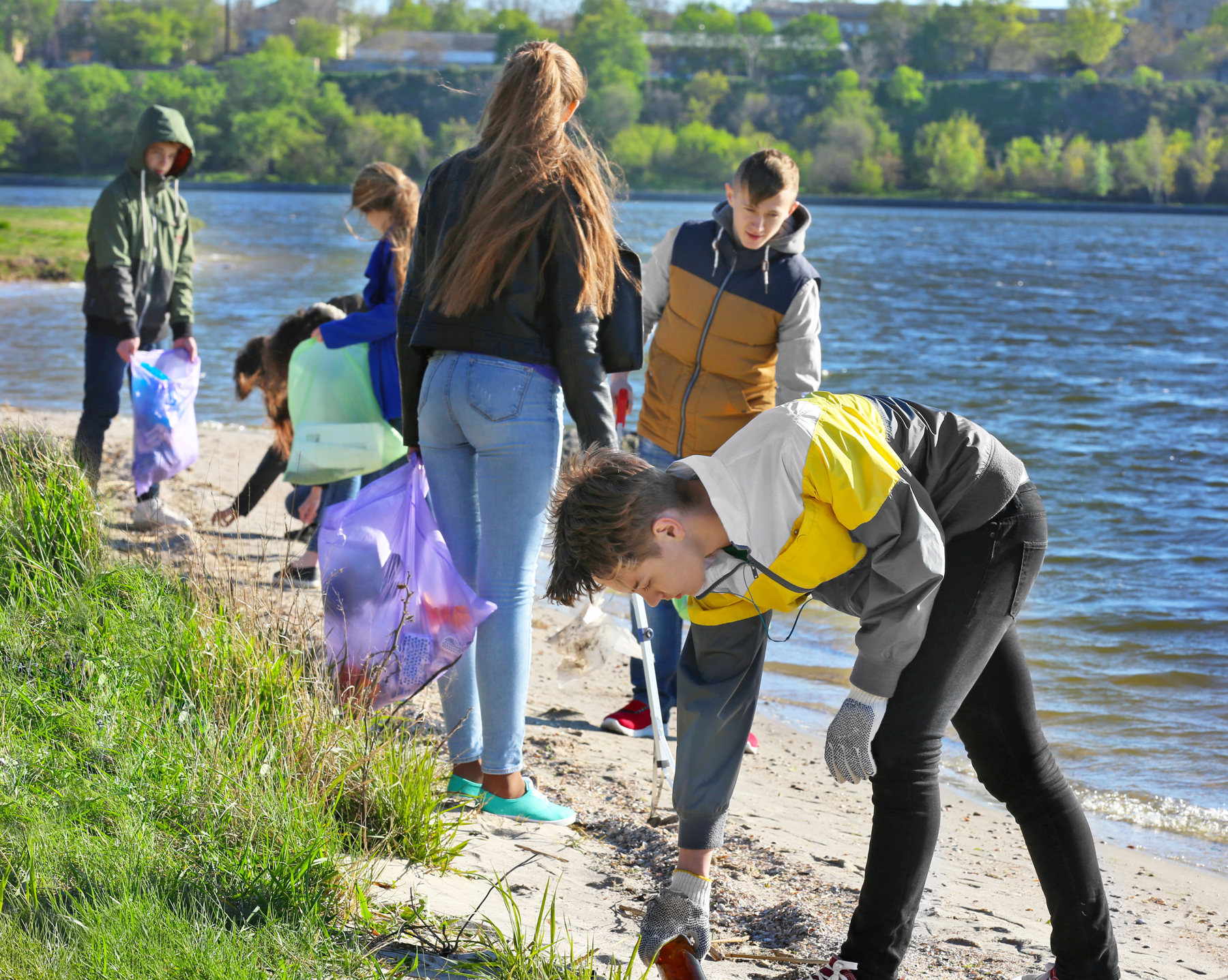 Young people doing a beach clean