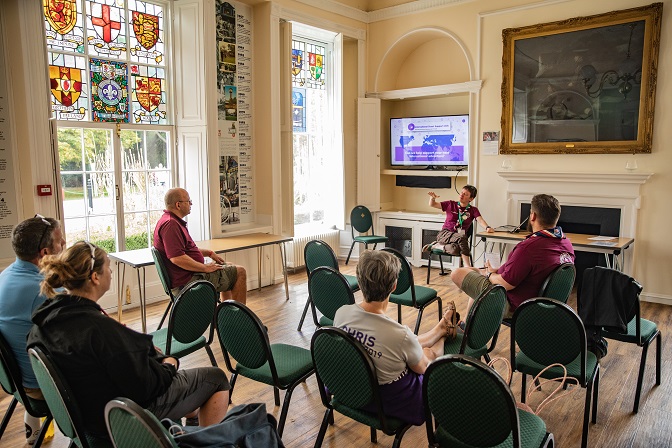 A presentation with five attendees inside the White House at Gilwell Park.