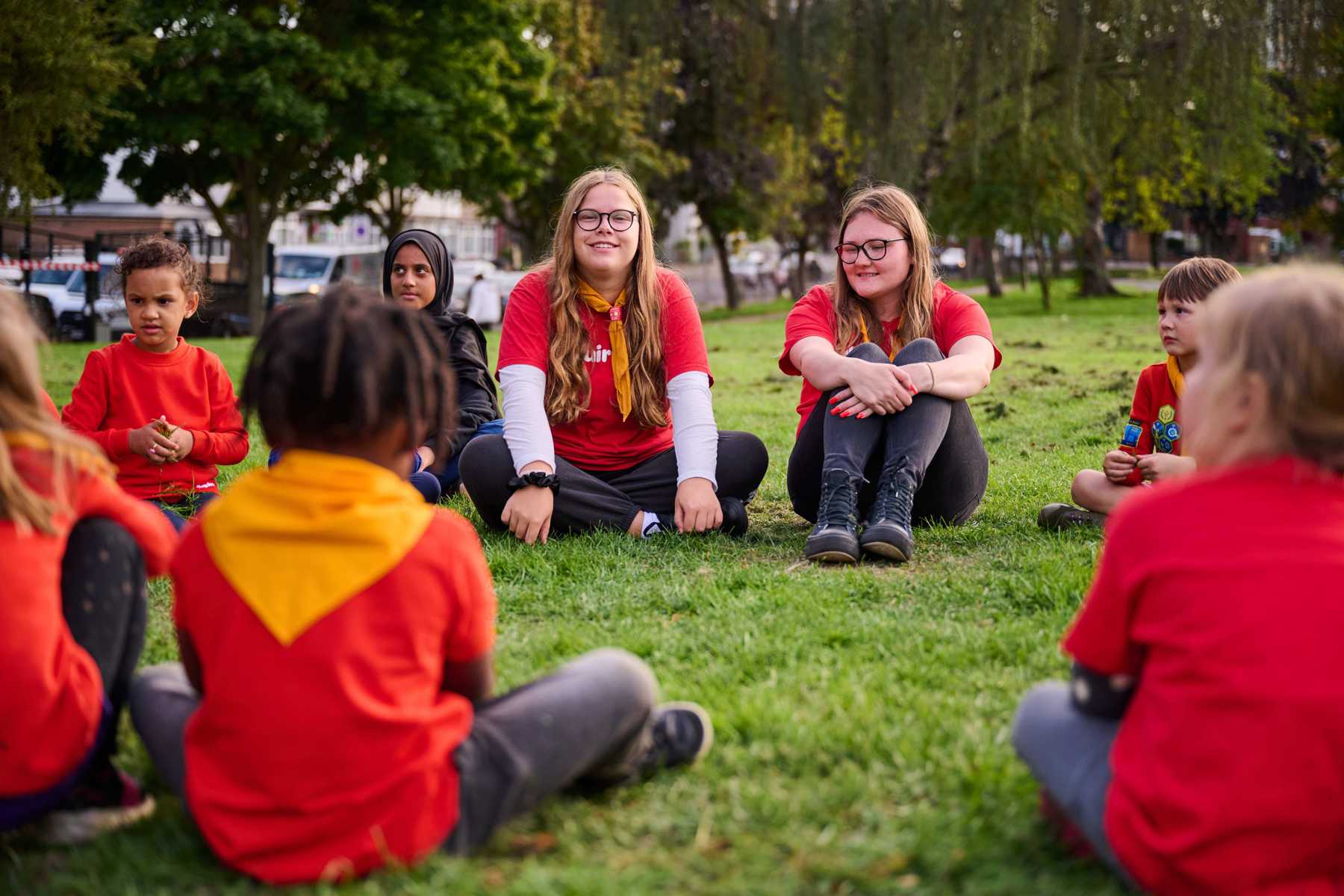 Volunteers in a circle with a group