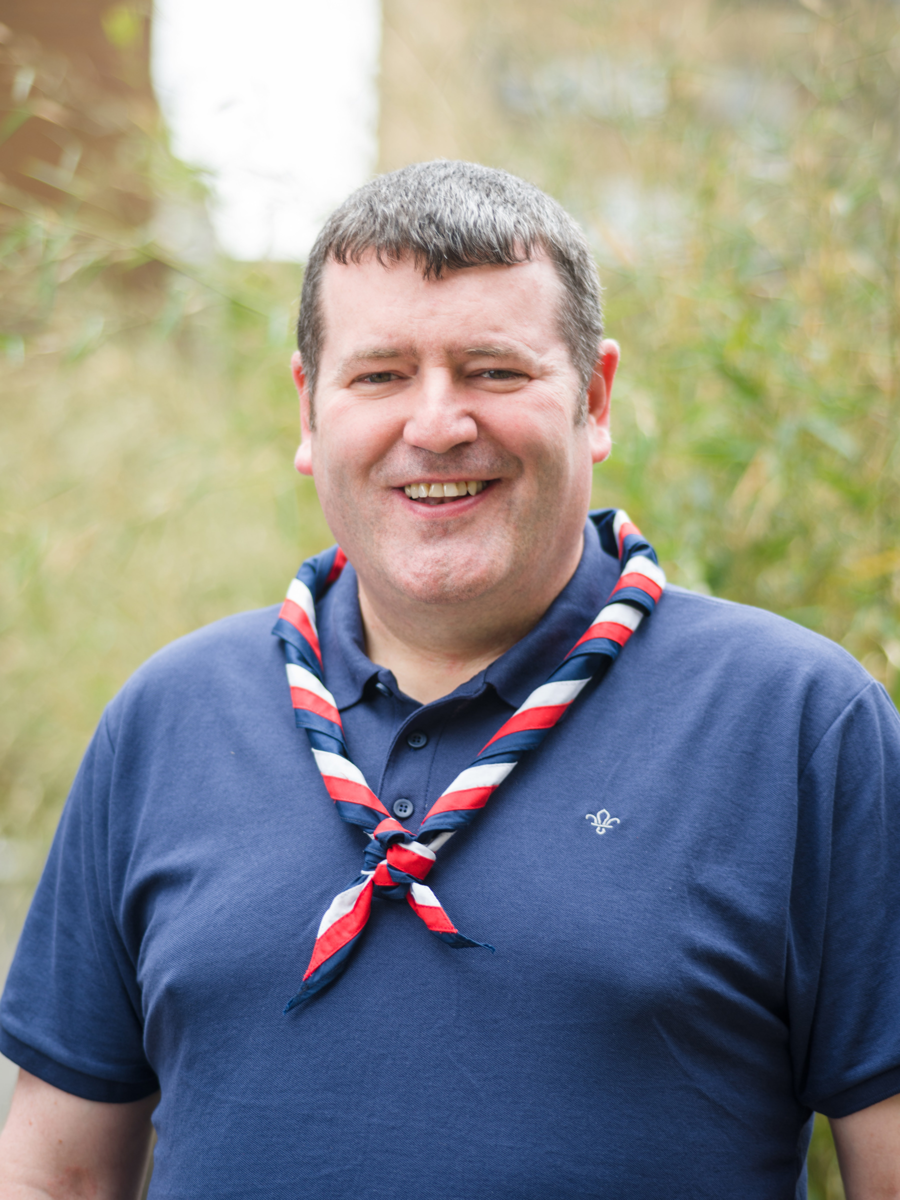 Chief Commissioner of Scotland, Andrew Sharkey in a navy polo wearing a UK necker