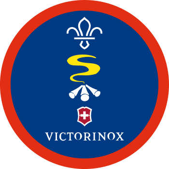 A blue badge with a campfire and the Victorinox logo