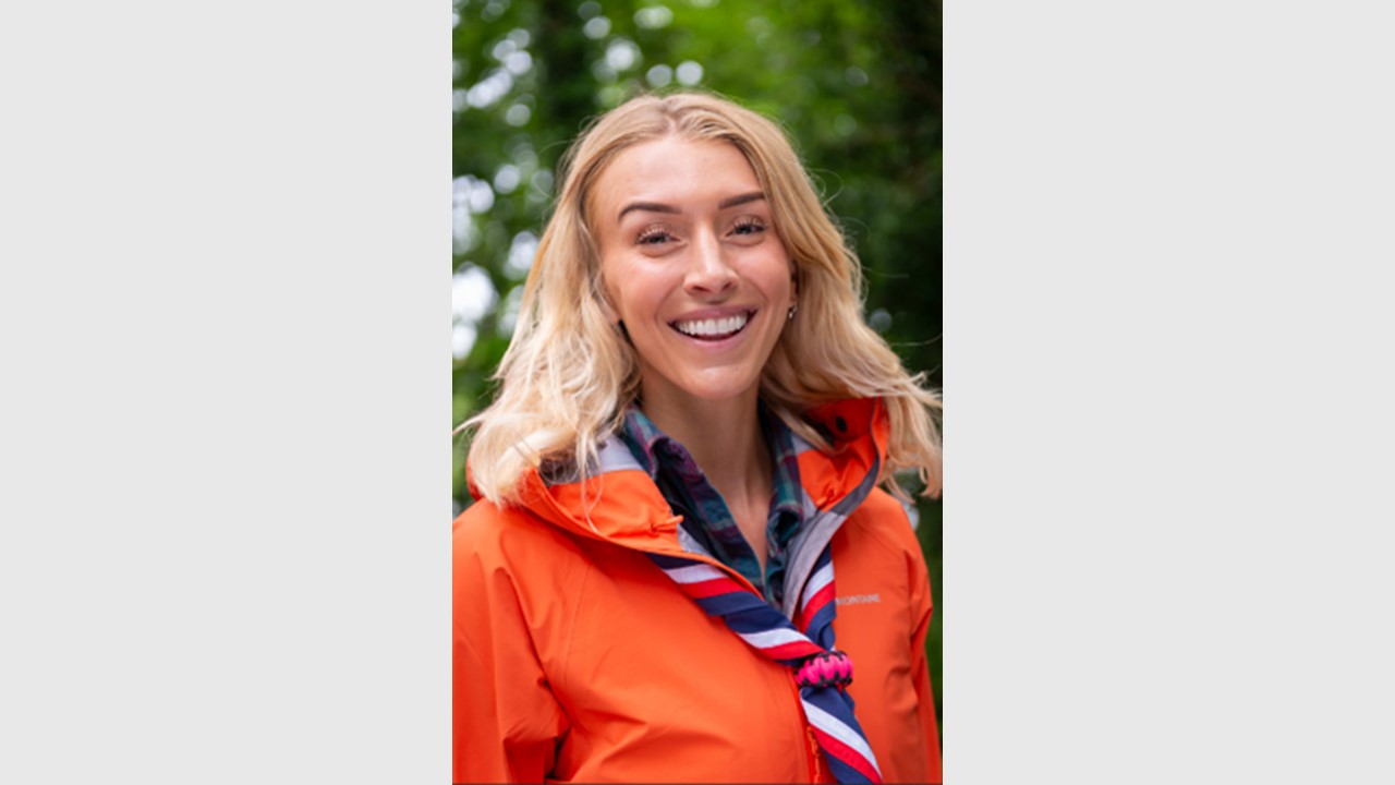 White woman with blonde hair smiling