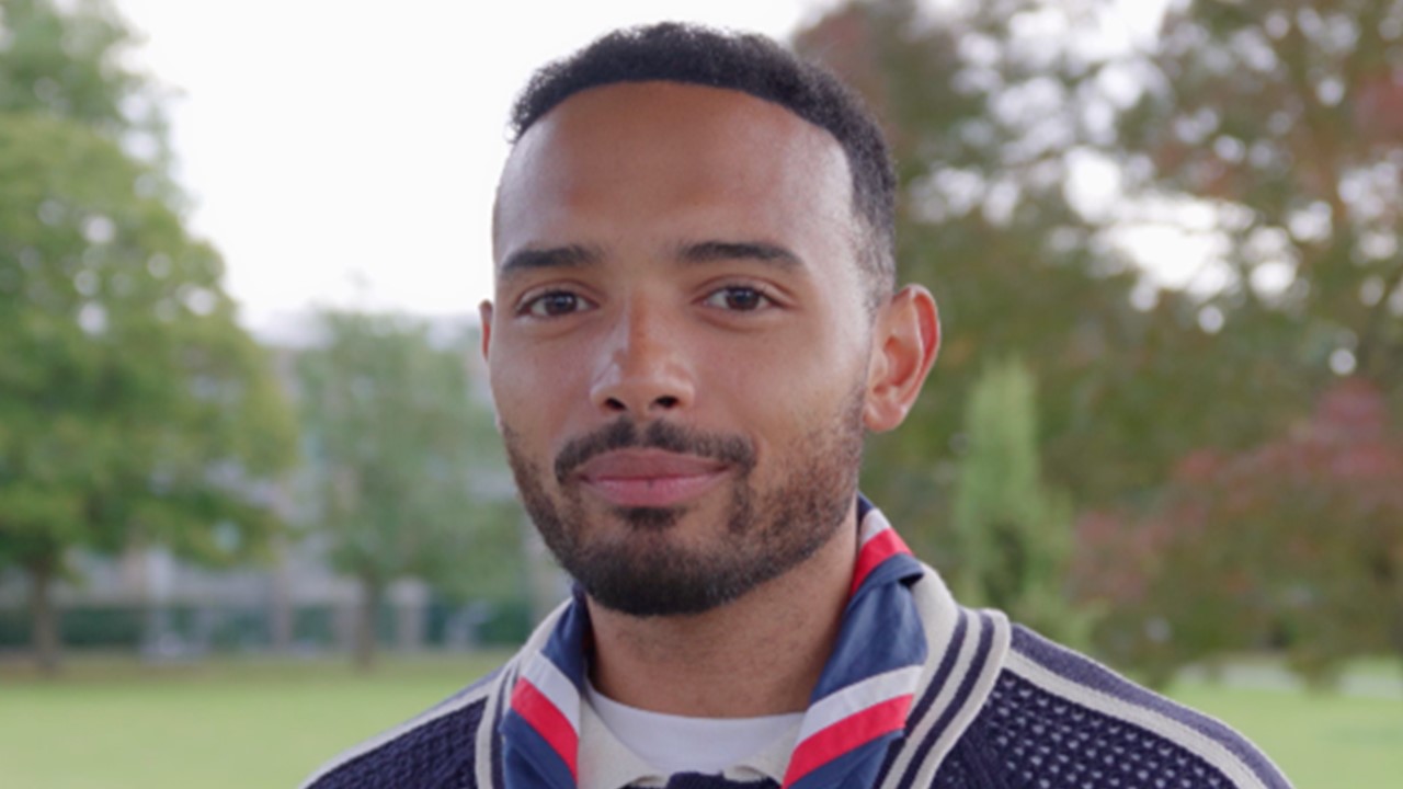 Liam, a young man with a beard, facing forward