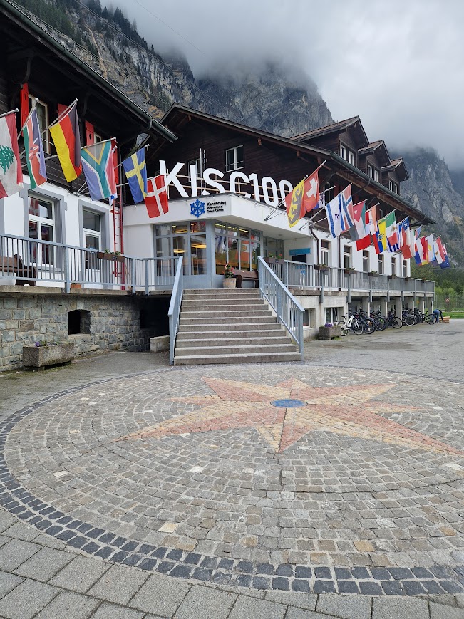 The Kandersteg Scout Centre entrance with flags hanging up.