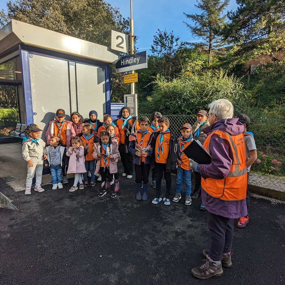 A Beaver colony visiting Hindley train station with a local volunteer