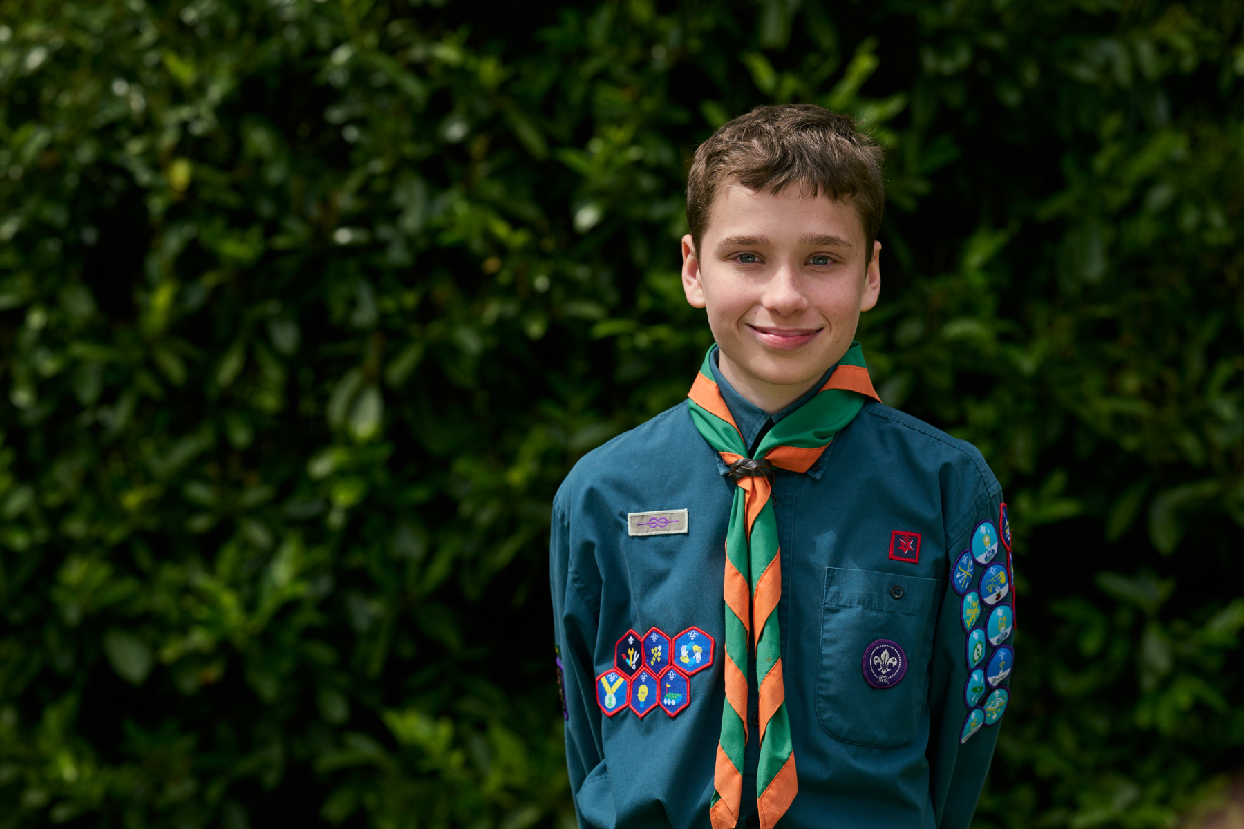 Unsung Hero Joshua Fuller, wearing Scouts uniform, smiles at the camera.