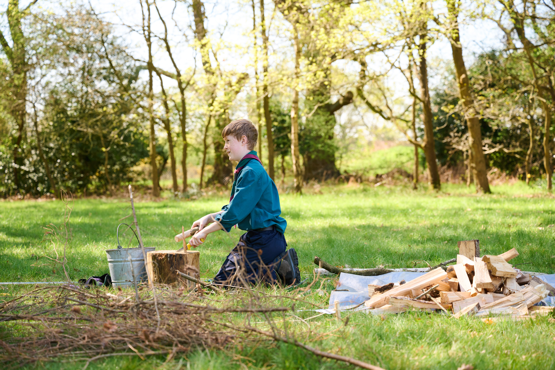 A Scout chopping firewood