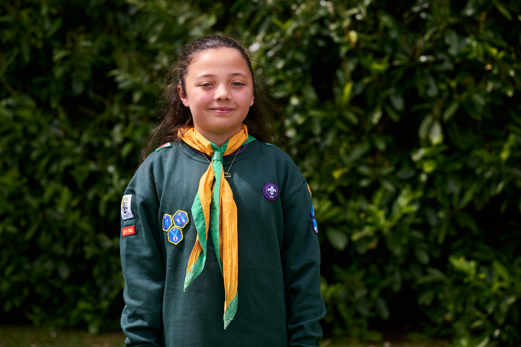 Unsung Hero Katie Thomas, wearing Scouts uniform, smiles at the camera.