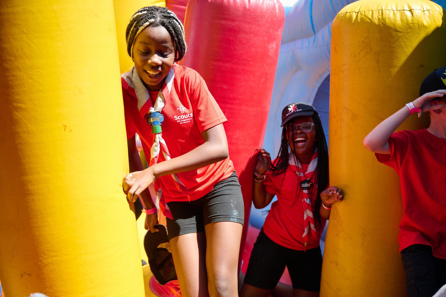 A girl running through inflatables