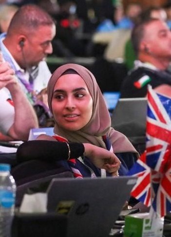 The image shows Ayesha Karim, UK Youth Lead at the 43rd World Scout Conference in Cairo